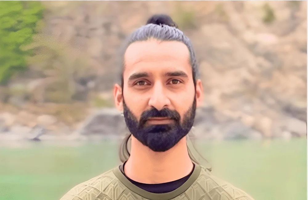 Yogi Prakash Bhatt beside the Ganges in Rishikesh